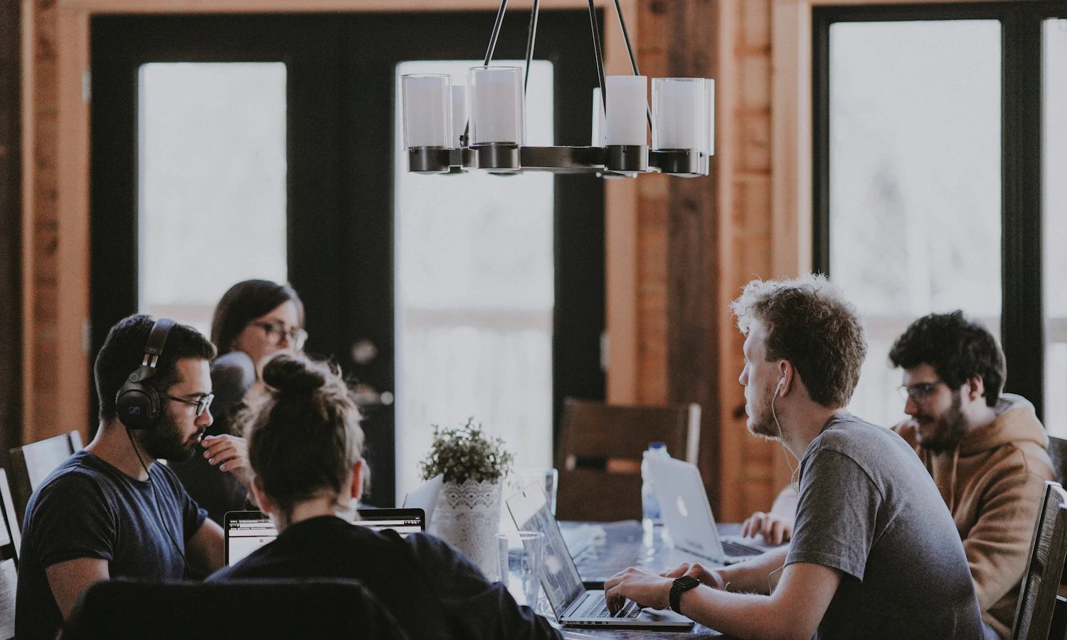 Real small business team discussing customer feedback and online reviews