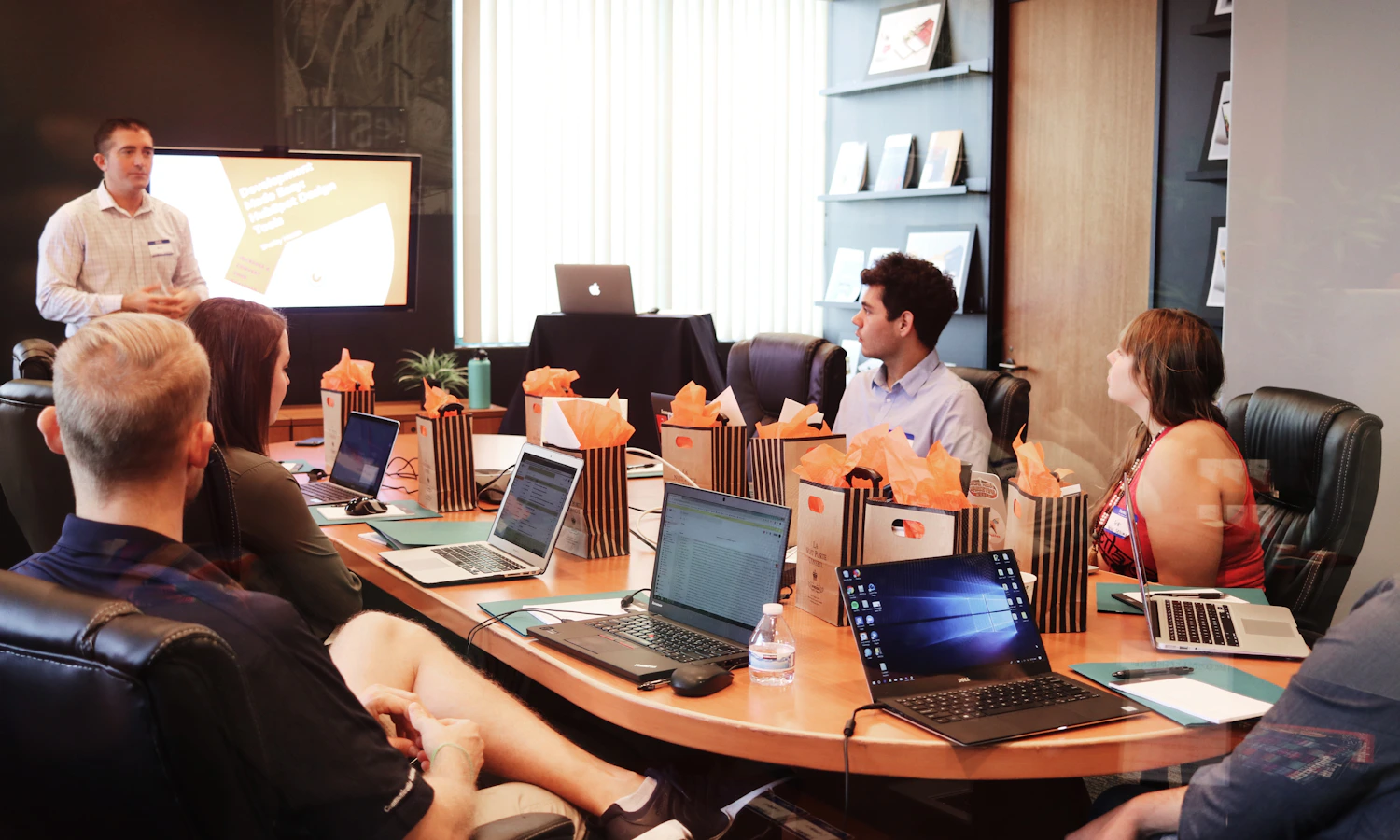 Real business team reviewing reputation data on a laptop